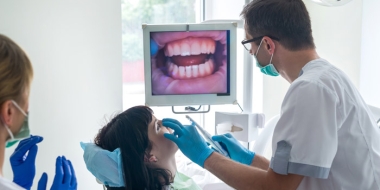 To what degree does Medicaid provide adult dental coverage?