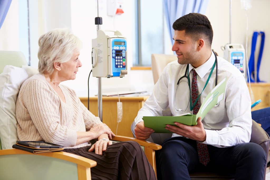 Cancer patient talking with doctor