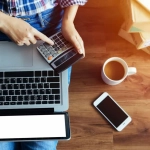 How does the IRS calculate premium tax credits for self-employed people when their AGI depends on their health insurance premium amount?